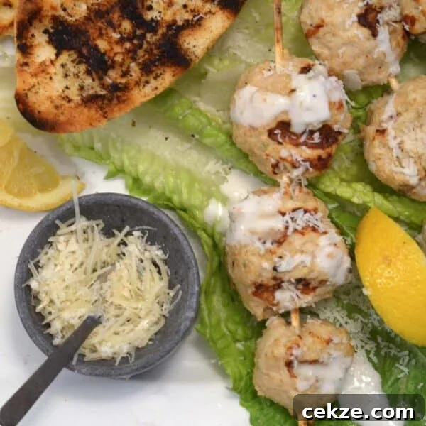 Chicken skewers on grill.