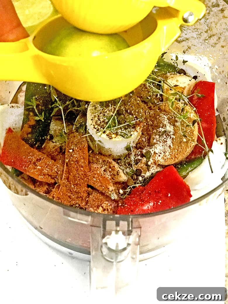 Food processor containing spices, herbs and vegetables