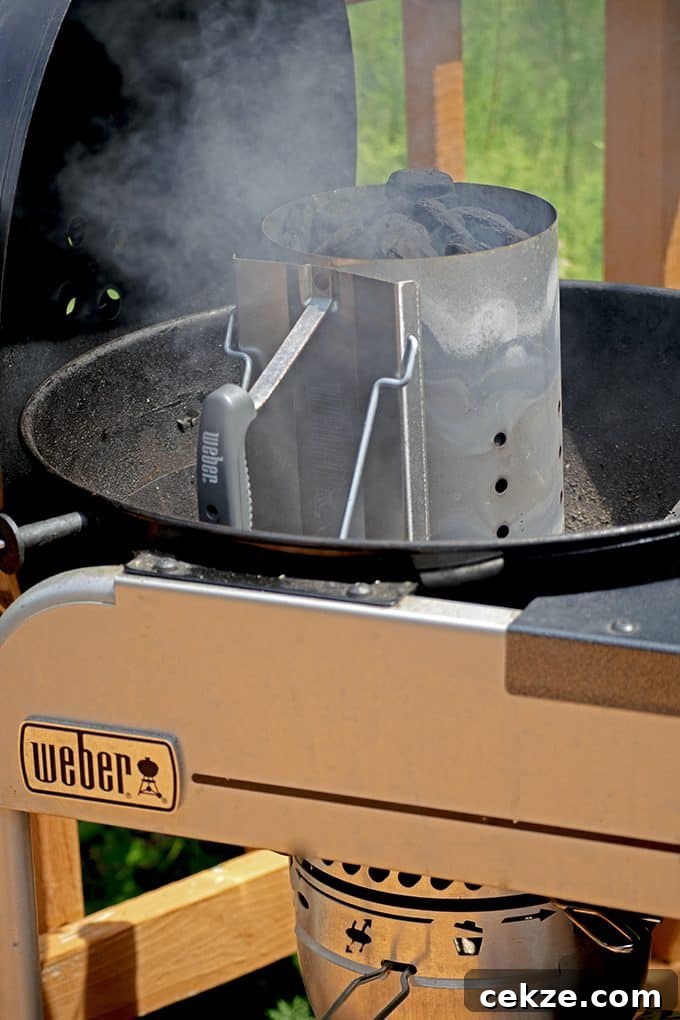 A charcoal chimney is a good way to light charcoal when making jerk chicken.