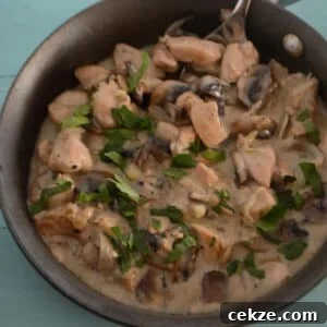 Creamy Garlic Mushroom Chicken Skillet Recipe 5 A skillet with chicken and mushrooms.