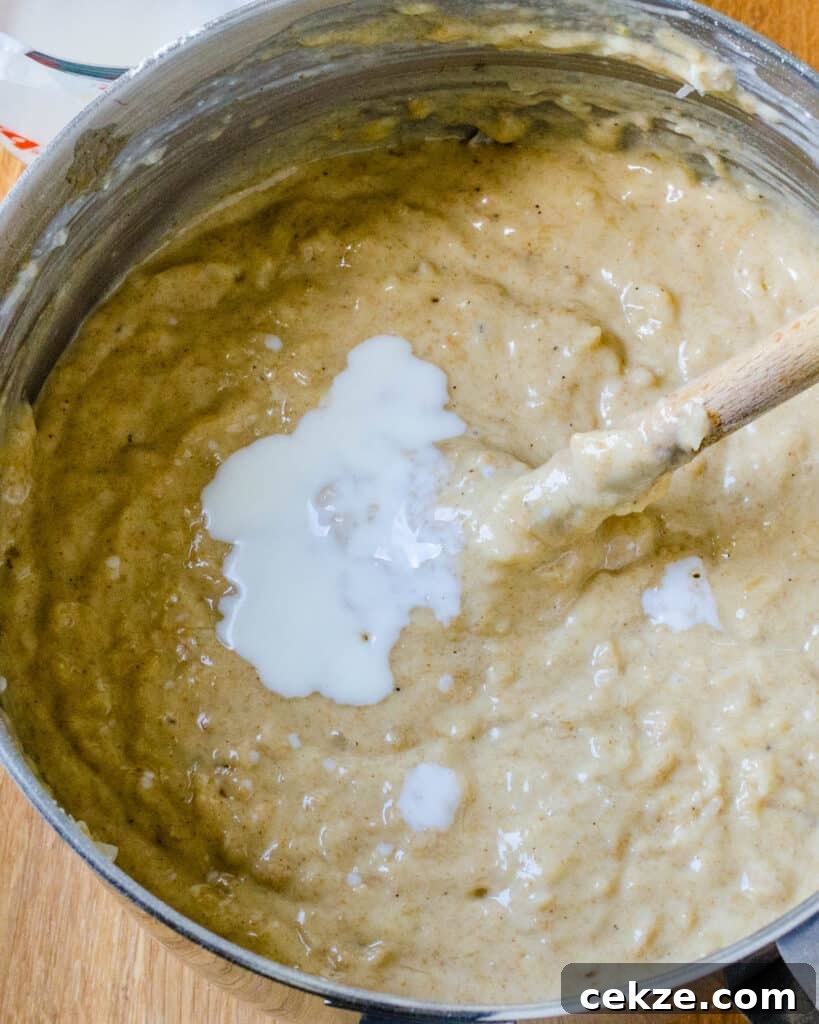 Adding wet ingredients for the batter.