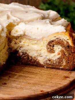 Carrot Cake Cheesecake Recipe: Moist Layered Dessert with Cream Cheese Frosting 14 Slice of carrot cake cheesecake on a platter.