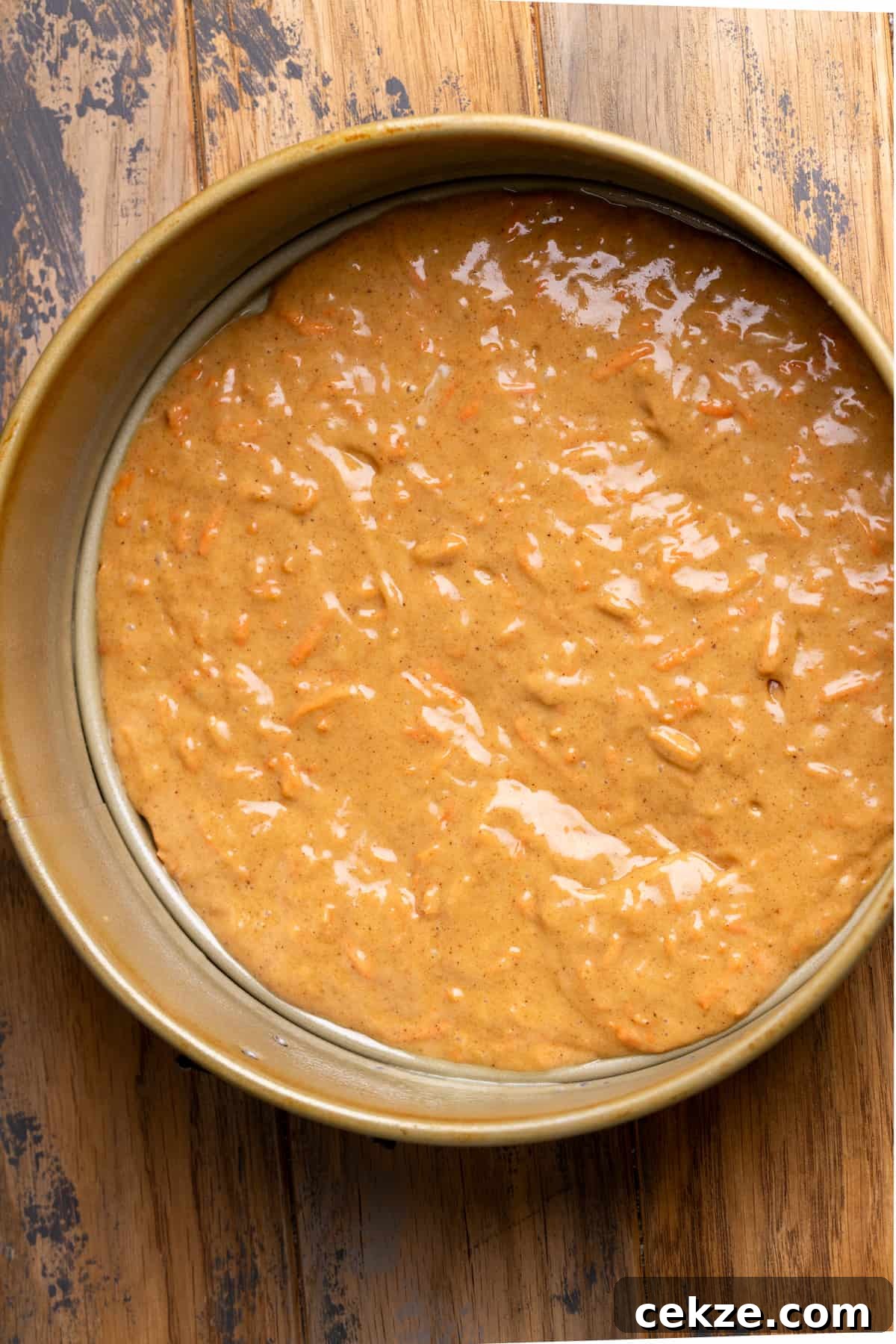 Carrot Cake Cheesecake Recipe: Moist Layered Dessert with Cream Cheese Frosting 7 Layer of carrot cake in springform pan.