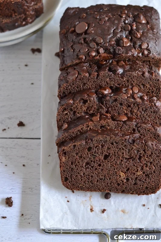 Chocolate Zucchini Bread with Less Sugar and Moist Texture 2 Overhead shot of chocolate zucchini bread on parchment paper