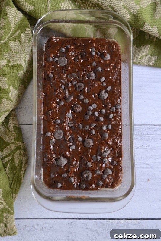 Chocolate Zucchini Bread with Less Sugar and Moist Texture 8 Healthy chocolate zucchini bread batter in loaf pan
