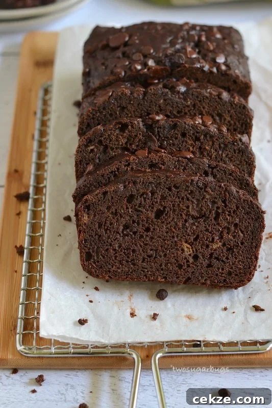 Chocolate Zucchini Bread with Less Sugar and Moist Texture 9 Chocolate zucchini bread on cooling rack and cutting board