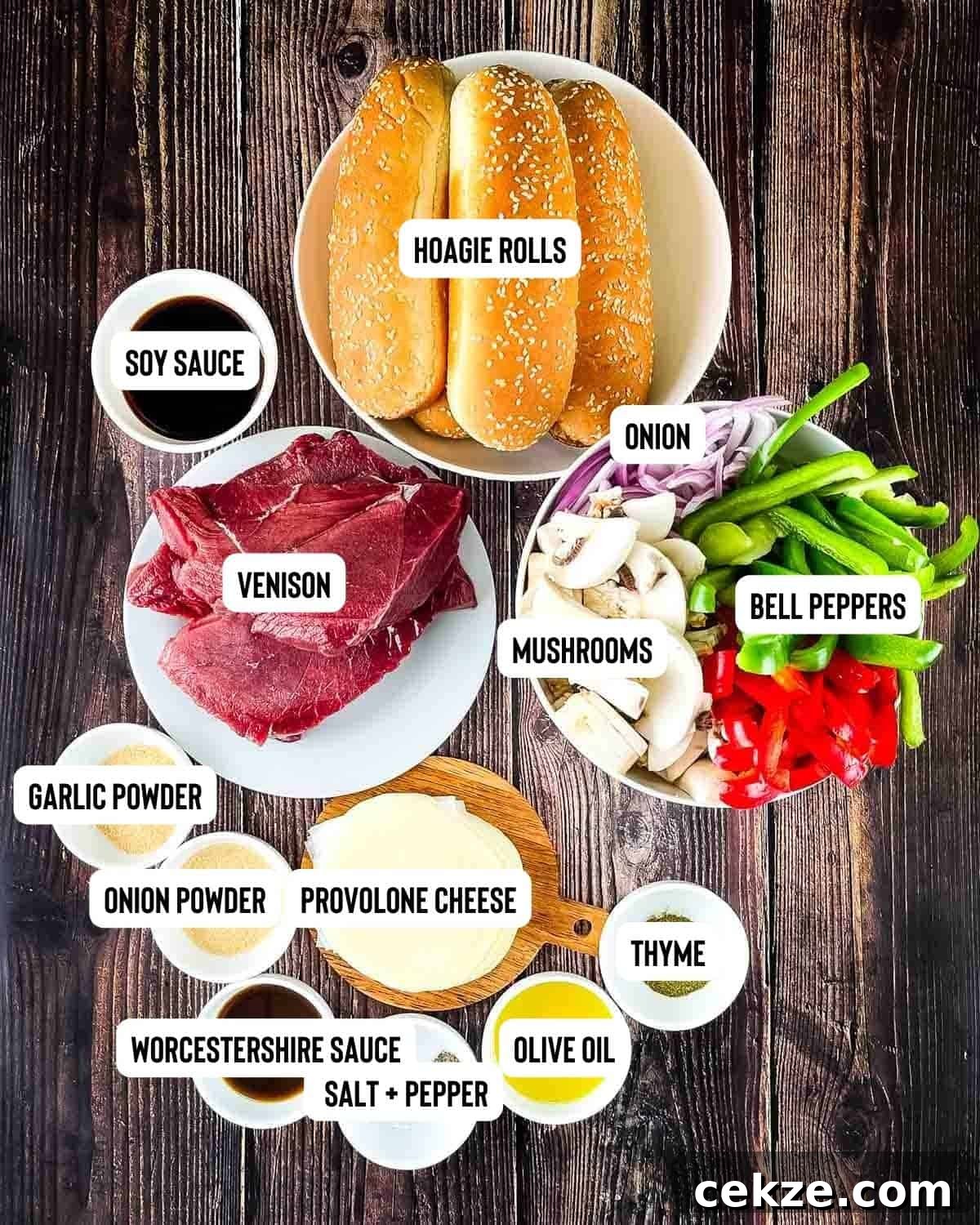 Ingredients for venison Philly cheesesteak measured out and placed on a wooden table.
