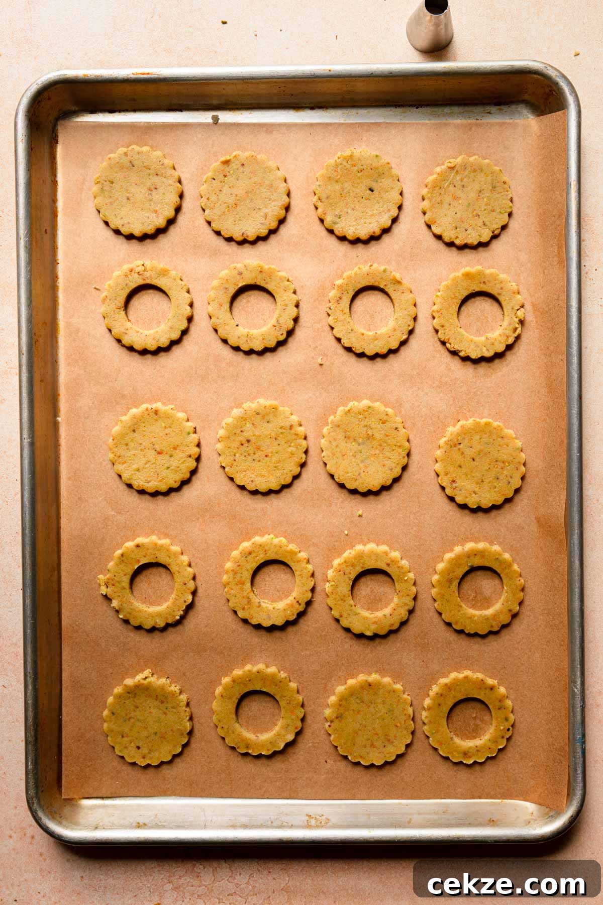 A baking pan with cut cookie dough.