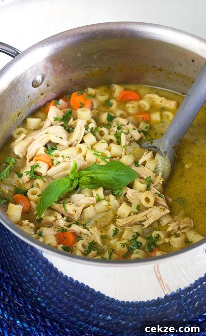 Pesto Chicken Noodle Soup in a stock pot.