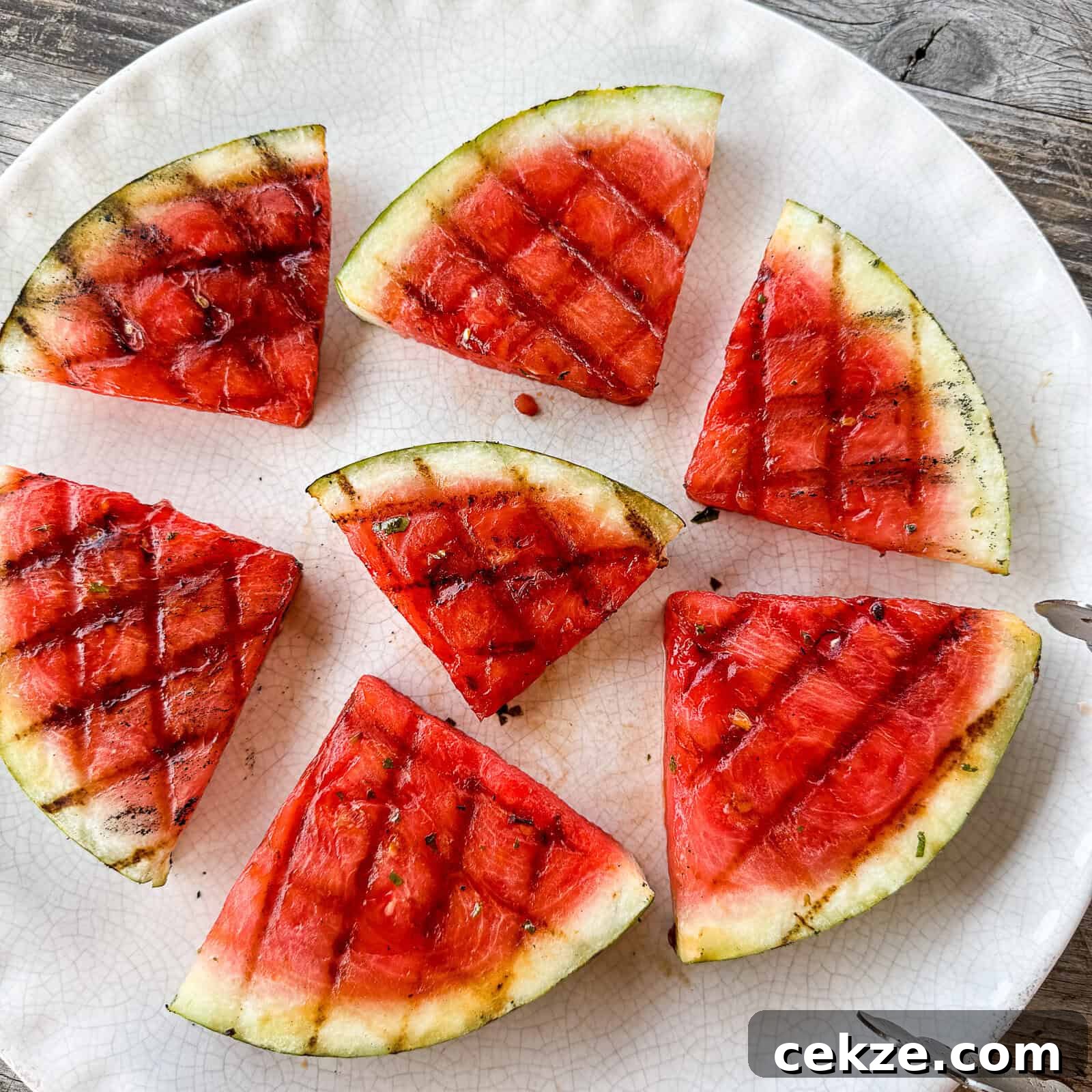 Grilled Watermelon Recipes: Sweet, Smoky Fruit for Summer BBQs 11 Grilled Watermelon with Char Marks on Appetizer Platter