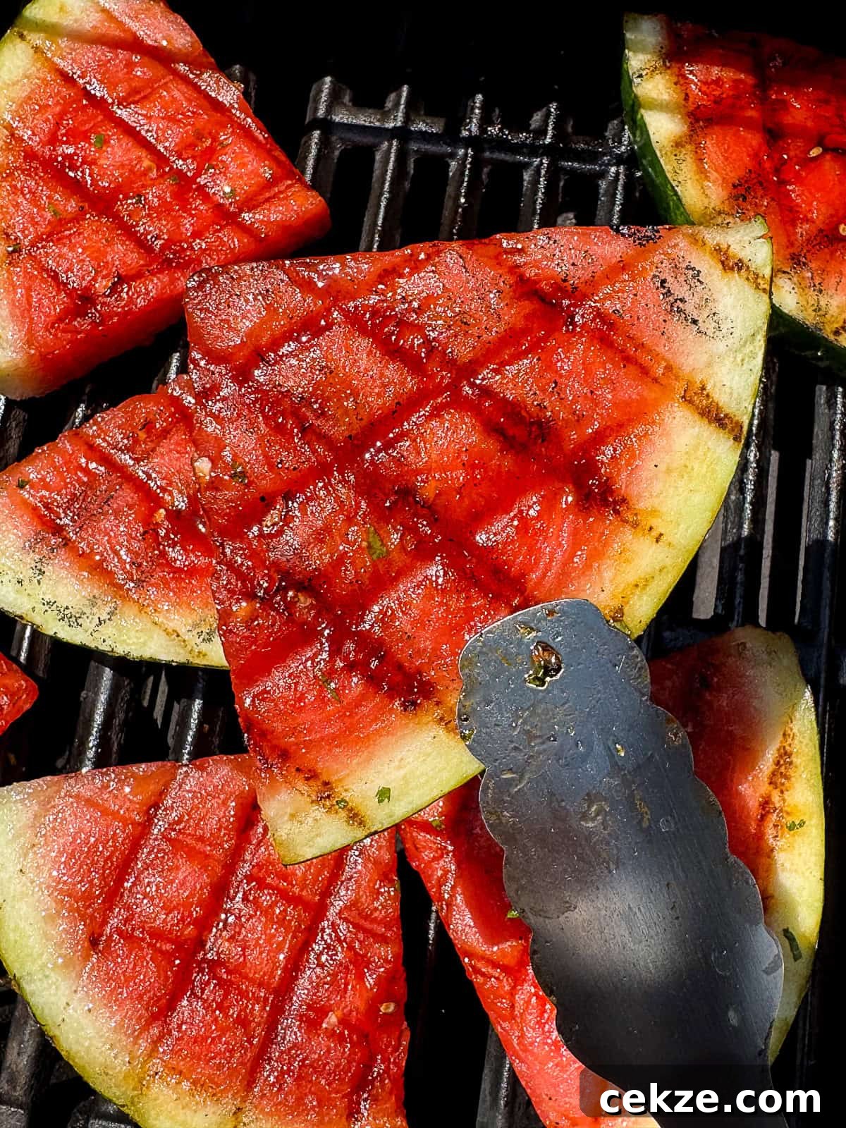Grilled Watermelon Recipes: Sweet, Smoky Fruit for Summer BBQs 13 Grilled Watermelon with BBQ Tongs