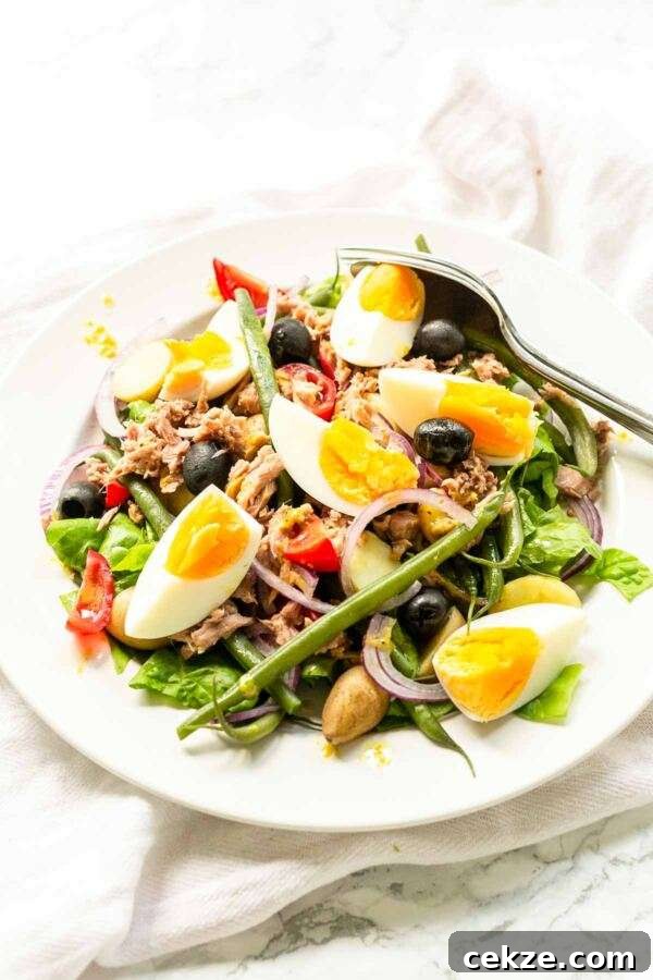 Classic Niçoise Salad Recipe: Tuna, Eggs & Mediterranean Veggies 2 A classic salad recipe this salad nicoise fits perfectly on your bistro menu. A great summer salad with summer vegetables, eggs, and tuna.