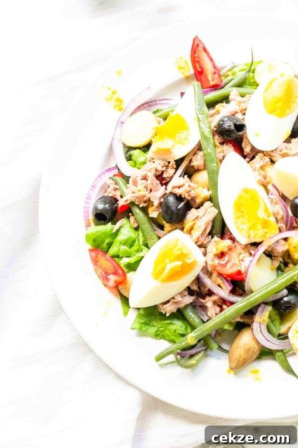 Classic Niçoise Salad Recipe: Tuna, Eggs & Mediterranean Veggies 3 A classic salad recipe this salad nicoise fits perfectly on your bistro menu. Serve for lunch or as a side dish with dinner. A great summer salad with summer vegetables, eggs, and tuna.