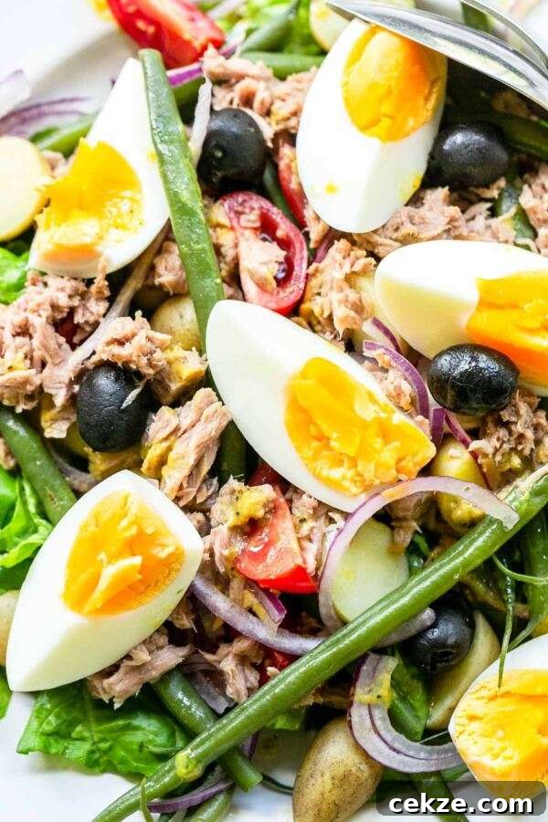 Classic Niçoise Salad Recipe: Tuna, Eggs & Mediterranean Veggies 5 A classic salad recipe this salad nicoise fits perfectly on your bistro menu. Serve for lunch or as a side dish with dinner. A great summer salad with summer vegetables, eggs and tuna. Super quick and easy so the ultimate fast-food recipe.
