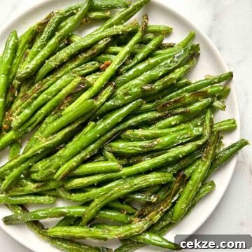 air-fried green beans on plate.