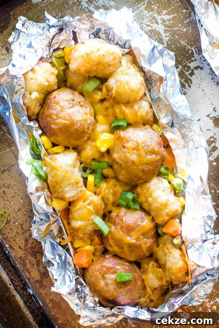 Tater Tot Meatball Foil Packets with Vegetables on sheet pan