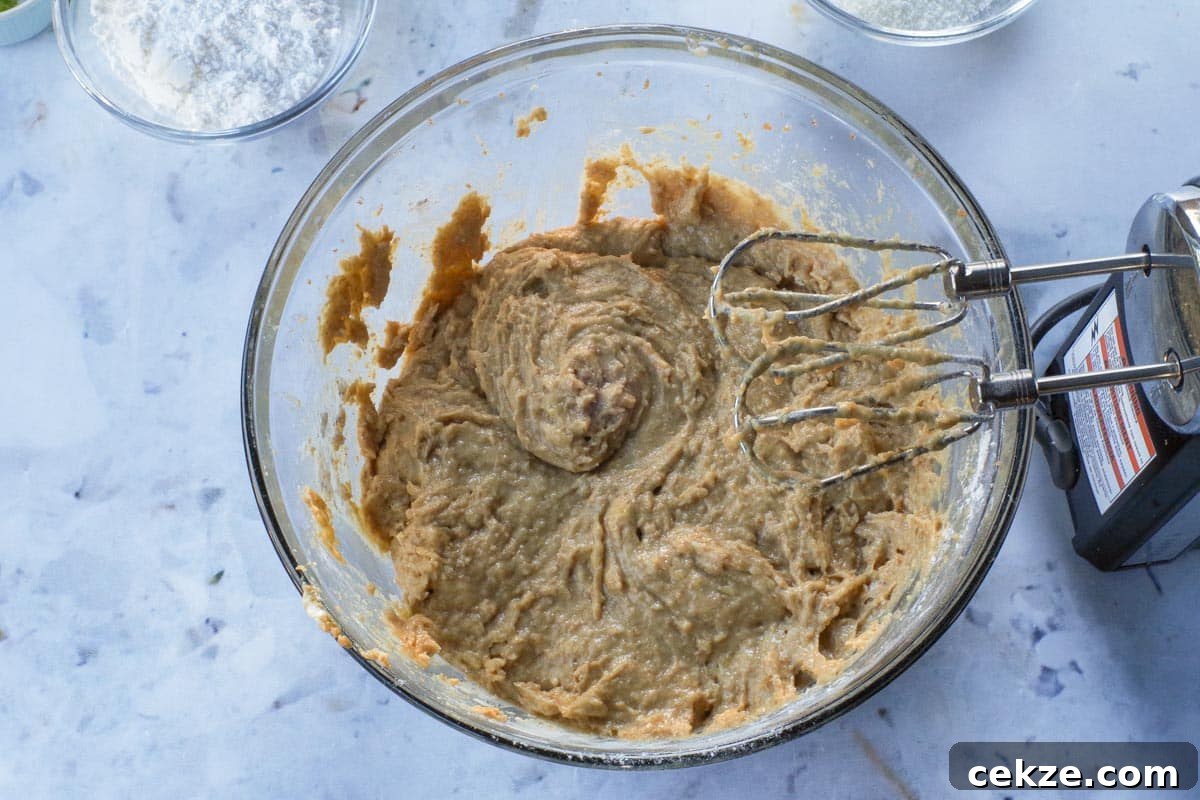 Tropical Banana Bread with Lime Glaze Recipe 8 Dry ingredients beaten into wet mixture, in large glass bowl, with electric mixer.