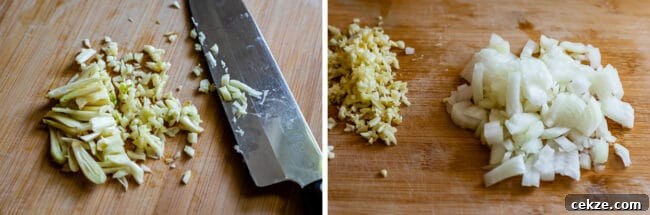 Classic Homemade Pizza Sauce Recipe for Perfect Pies 9 garlic minced on a wooden board with knife, onions chopped on a wooden board.