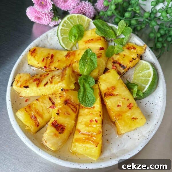 Grilled Pineapple Recipes and Tips for Perfect Caramelized Rings 4 honey lime pineapple on plate with hot pepper flakes