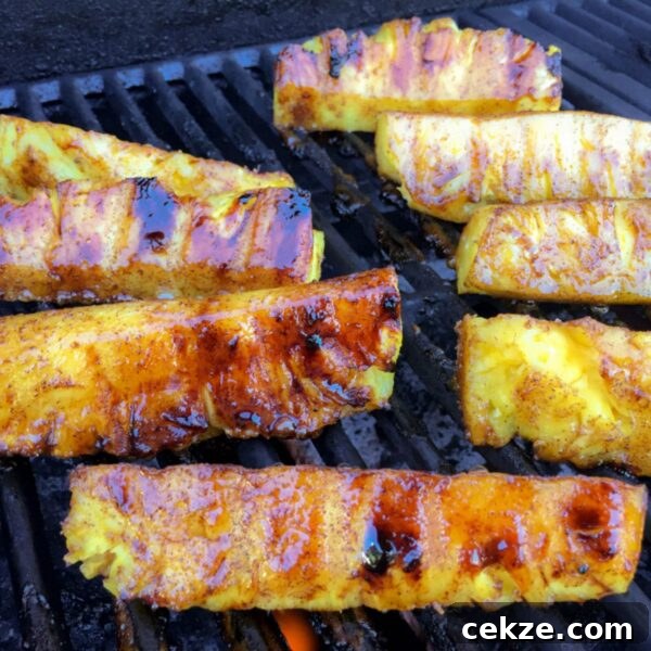 Grilled Pineapple Recipes and Tips for Perfect Caramelized Rings 6 pineapple spears on BBQ grill with caramelized sugar