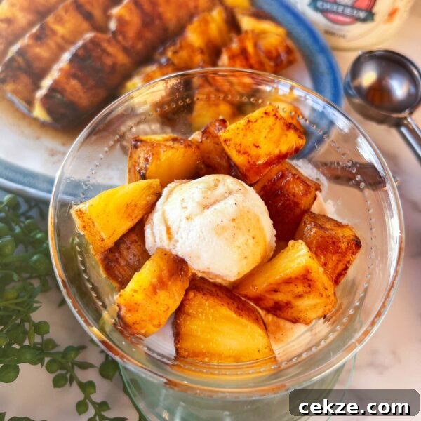 Grilled Pineapple Recipes and Tips for Perfect Caramelized Rings 8 pieces of grilled pineapple in bowl with ice cream