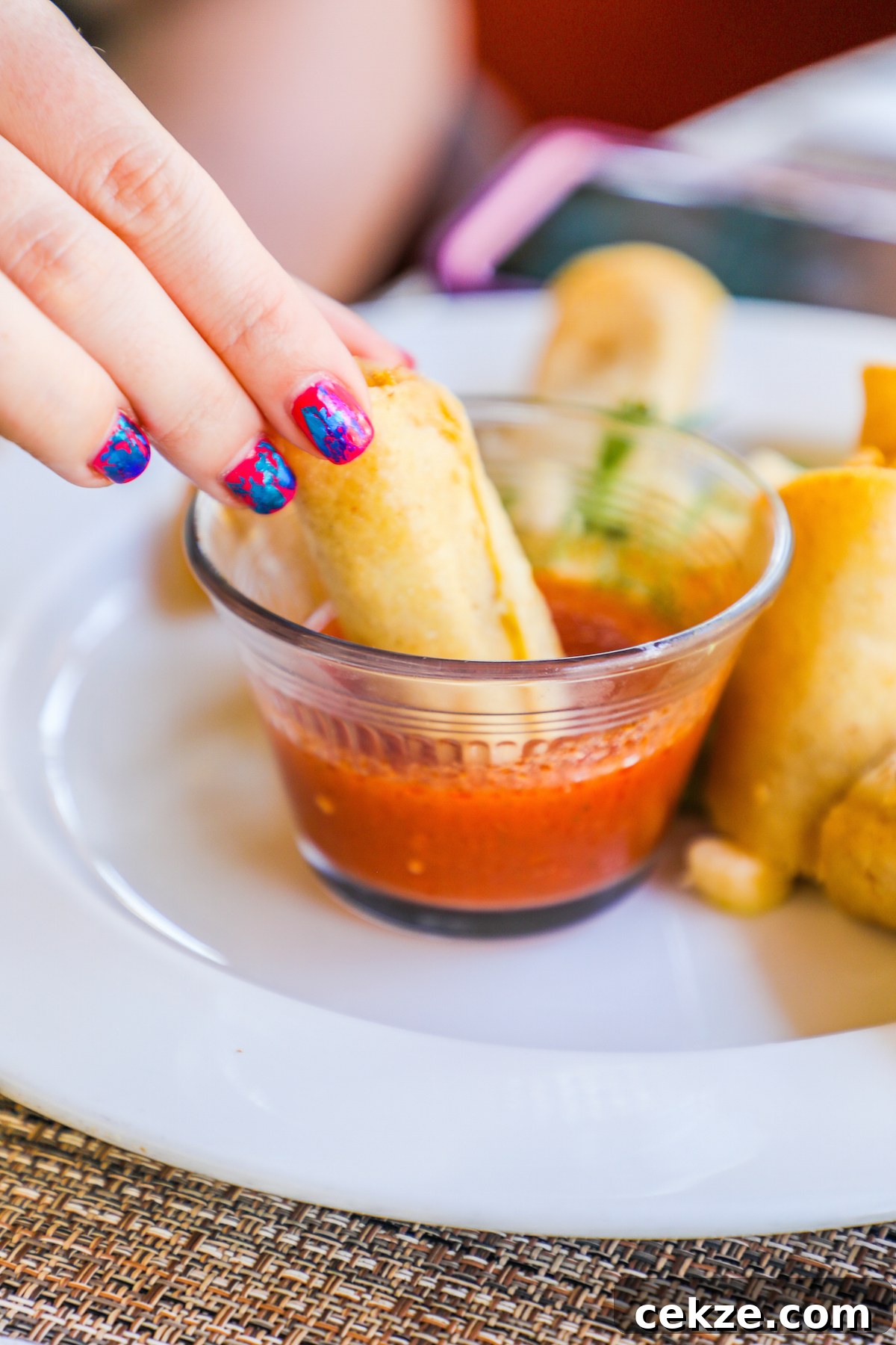 Tortilla dipped in sauce