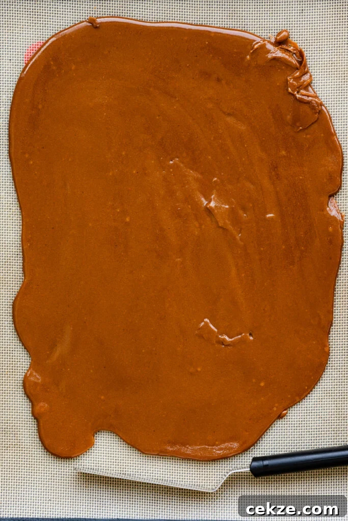 Brown Sugar Toffee Cookies Recipe — Chewy Caramelized Treats 3 Hot toffee spread into a thin layer across a silpat mat.