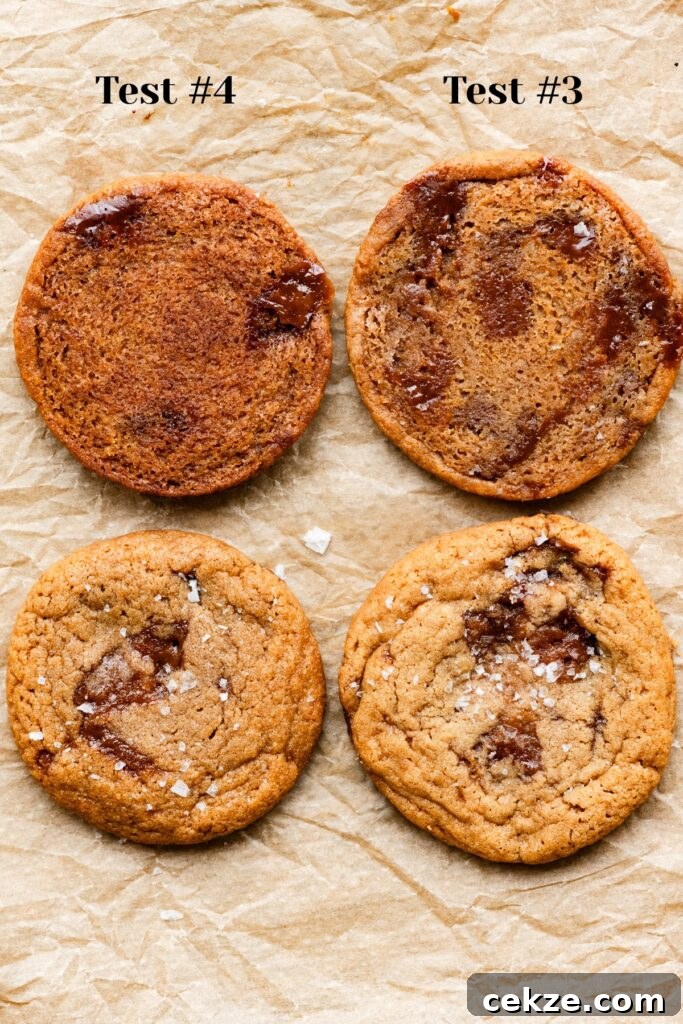 Brown Sugar Toffee Cookies Recipe — Chewy Caramelized Treats 6 Two upside down cookies and two right site up cookies filled with toffee chunks on a baking sheet.
