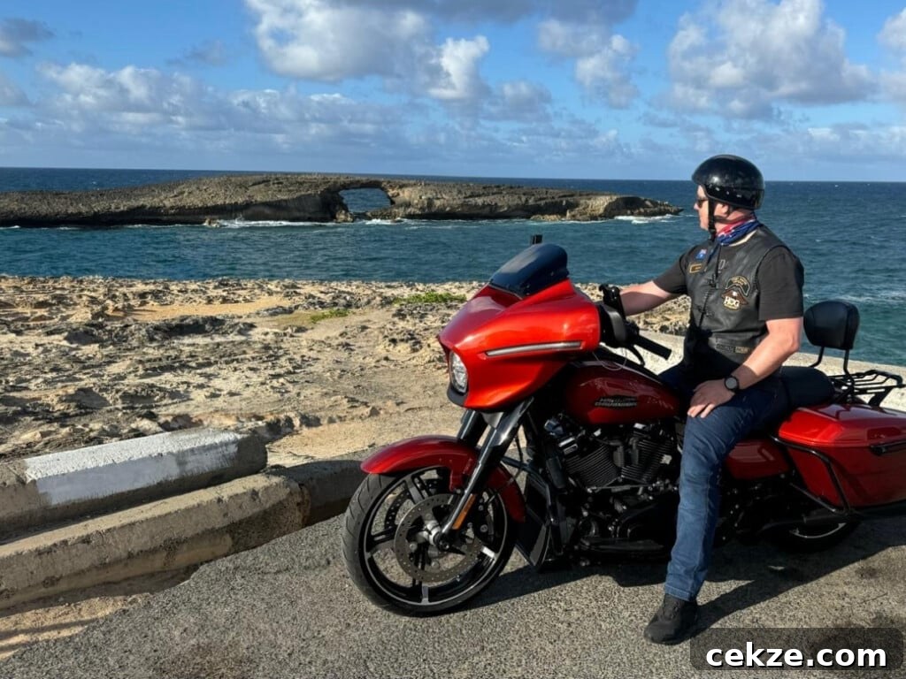 Scenic Oʻahu Lookouts You Can Drive To 10 Lāʻie Point State Wayside in the background, a man on a red Harley-Davidson in the foreground.
