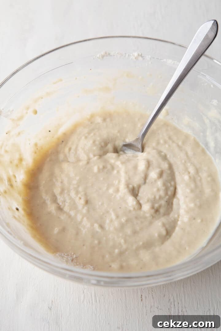 beige dumpling batter in a glass bowl.
