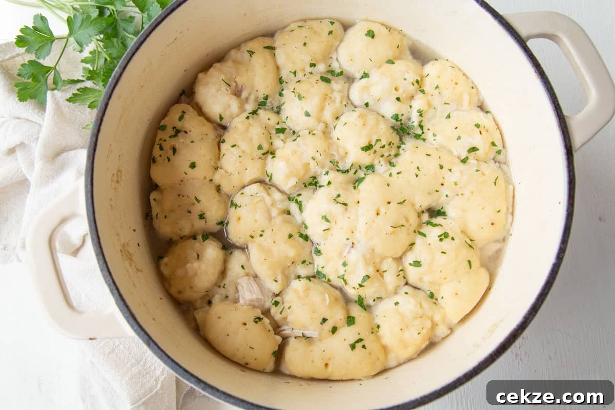 large pot filled with fluffy dumplings.