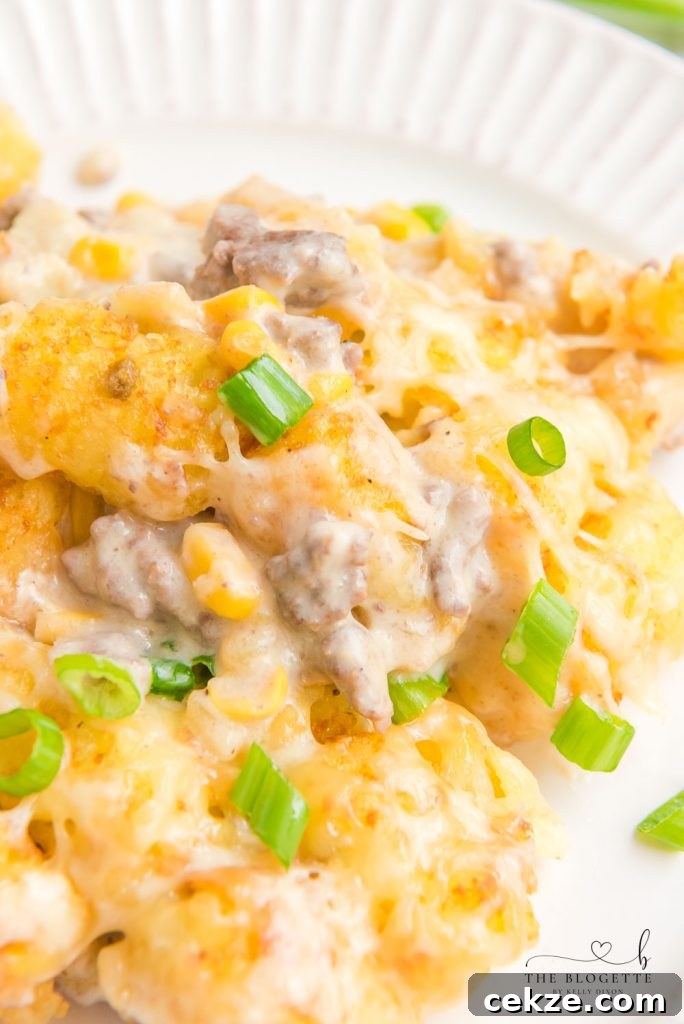Hearty Cowboy Casserole: Cheesy Ground Beef & Potato Bake 10 Cowboy Casserole is an easy and comfort-food dinner with simple ingredients like ground beef, corn, cheese, and sour cream, then topped with delicious tater tots.