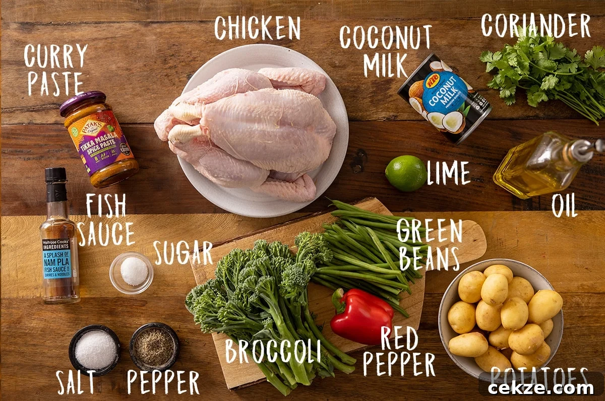Curry-Roasted Chicken with Crispy Skin and Aromatic Spices 4 Ingredients for curry roast chicken on a wooden table.