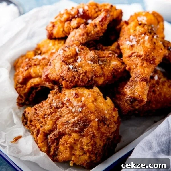 Curry-Roasted Chicken with Crispy Skin and Aromatic Spices 8 Pieces of crispy fried chicken on a tray