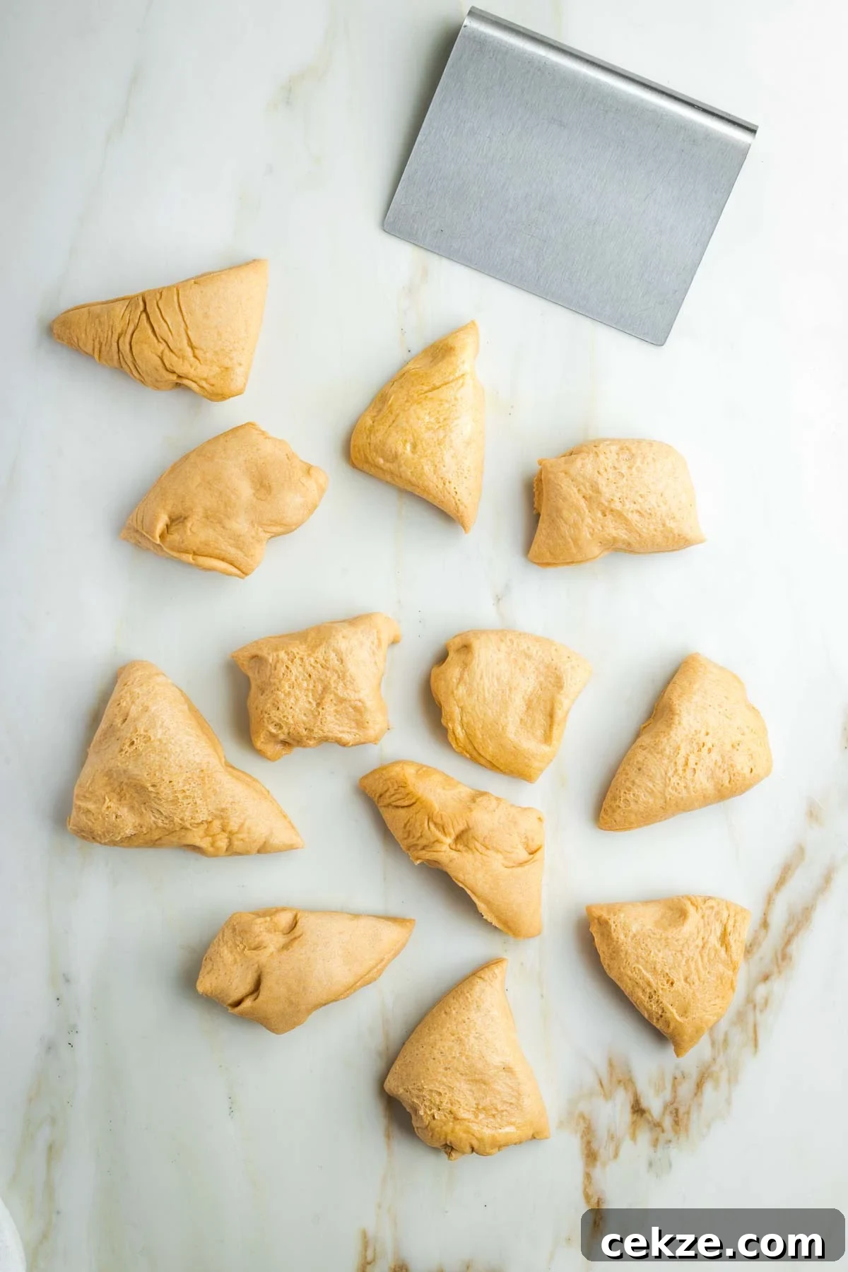 Sweet Round Challah Recipe: Soft, Shiny Braided Dinner Bread 19 Dough scraper and 12 small pieces of bread dough.