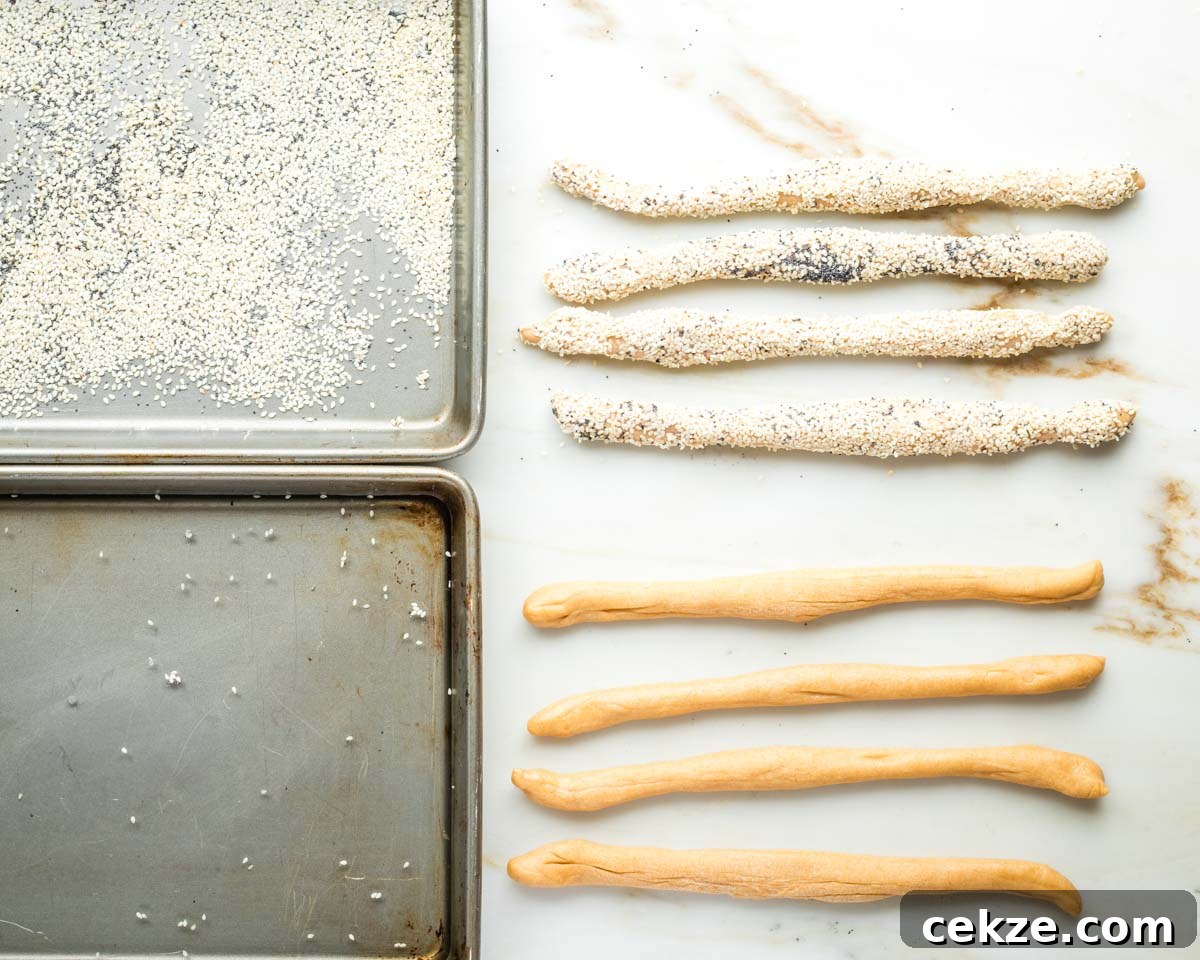 Sweet Round Challah Recipe: Soft, Shiny Braided Dinner Bread 23 Pan of water, pan of sesame seeds and strands of dough, half covered in the seeds.