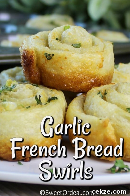 Golden brown plated dinner rolls.