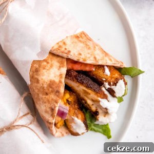 chicken shawarma on a white plate on white table