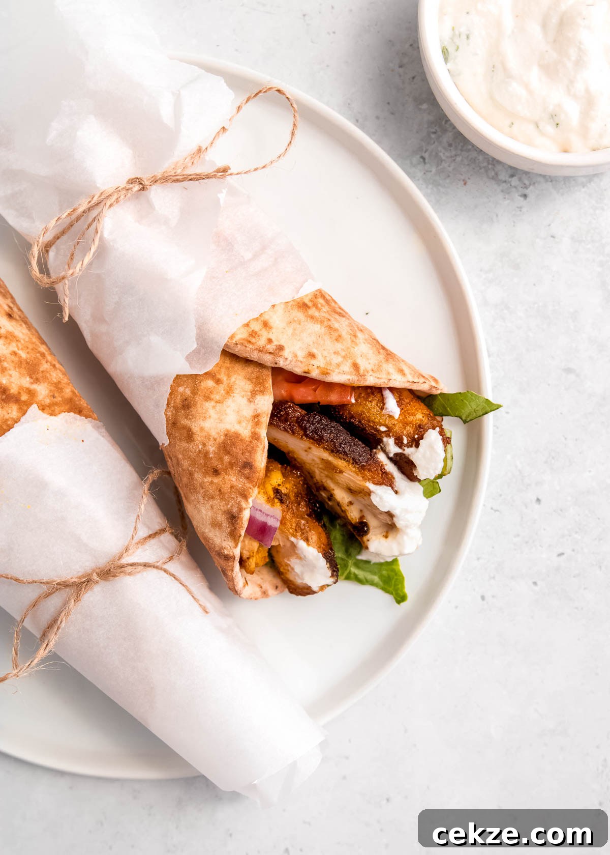 overhead image of chicken shawarma on white plate 