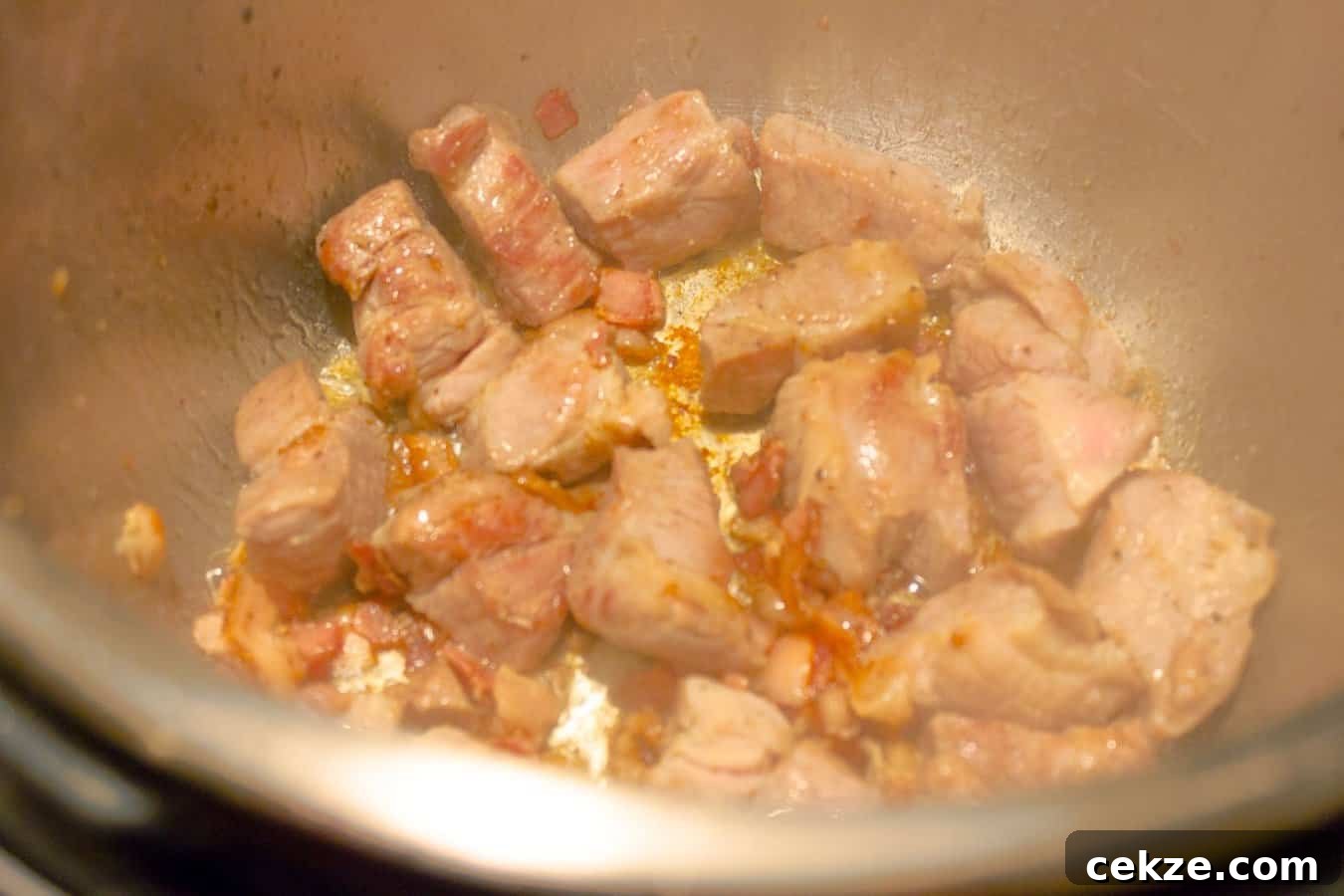 Instant Pot Red Pork Carnitas Chili Recipe 5 Pork and bacon being browned for Instant Pot Pressure Cooker Red Pork Chili
