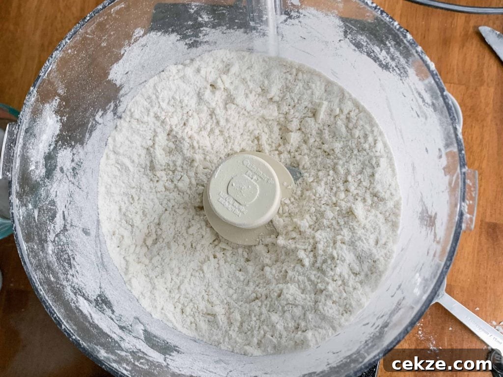 Flaky All-Butter Pie Crust Recipe for Perfect Homemade Pies 3 Pie Crust-Process the butter and flour until it looks like course sand