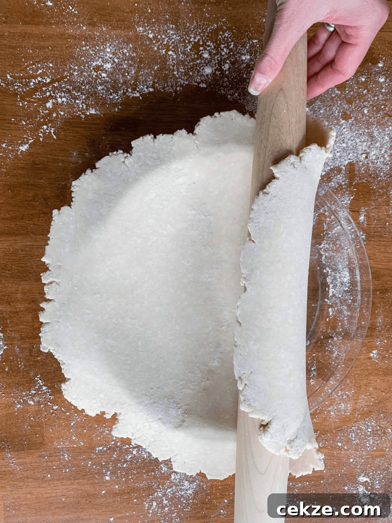 Flaky All-Butter Pie Crust Recipe for Perfect Homemade Pies 5 An easy way to roll pie dough onto your pie plate