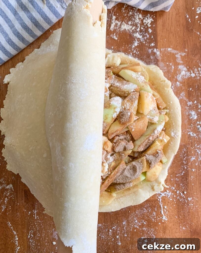 Flaky All-Butter Pie Crust Recipe for Perfect Homemade Pies 8 Use your rolling pin to transfer your top crust to the pie