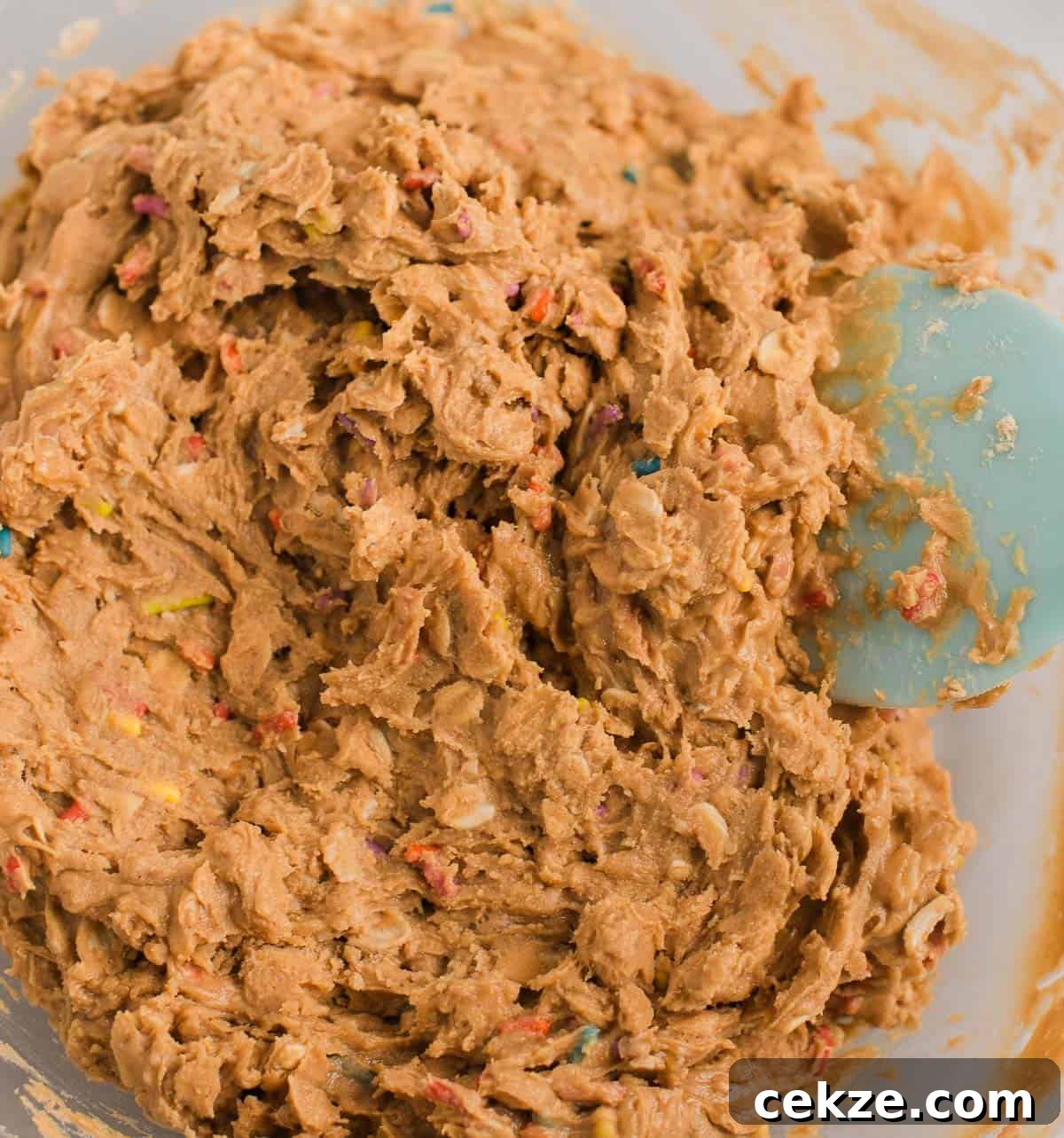 Birthday Cake Protein Balls Recipe for High-Protein Snacks 7 birthday cake protein ball batter in a mixing bowl