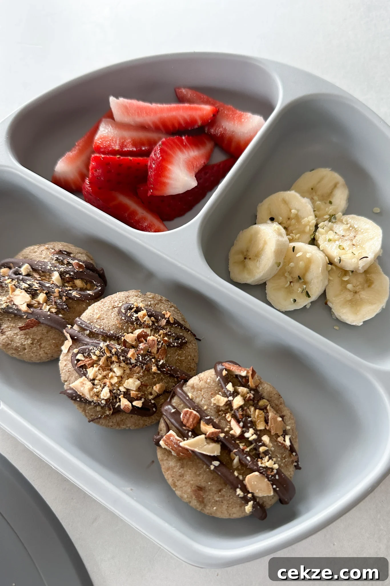 Banana bread cookies served with strawberries.