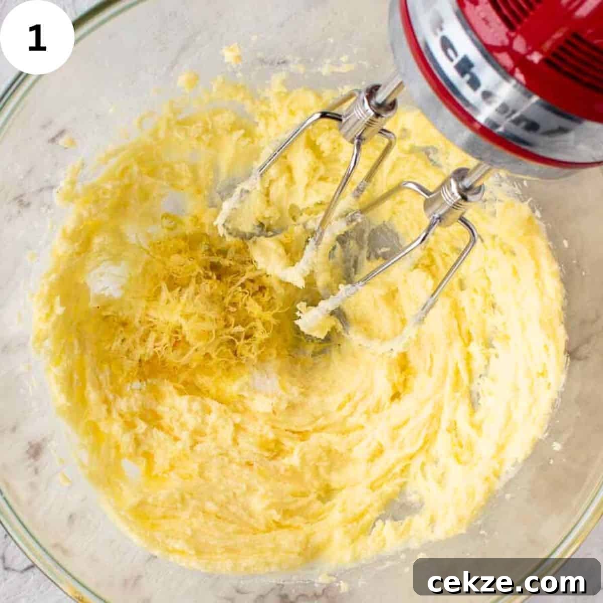 Classic German Plum Cake Recipe (Zwetschgenkuchen) 4 Beating butter and sugar with an electric hand mixer.