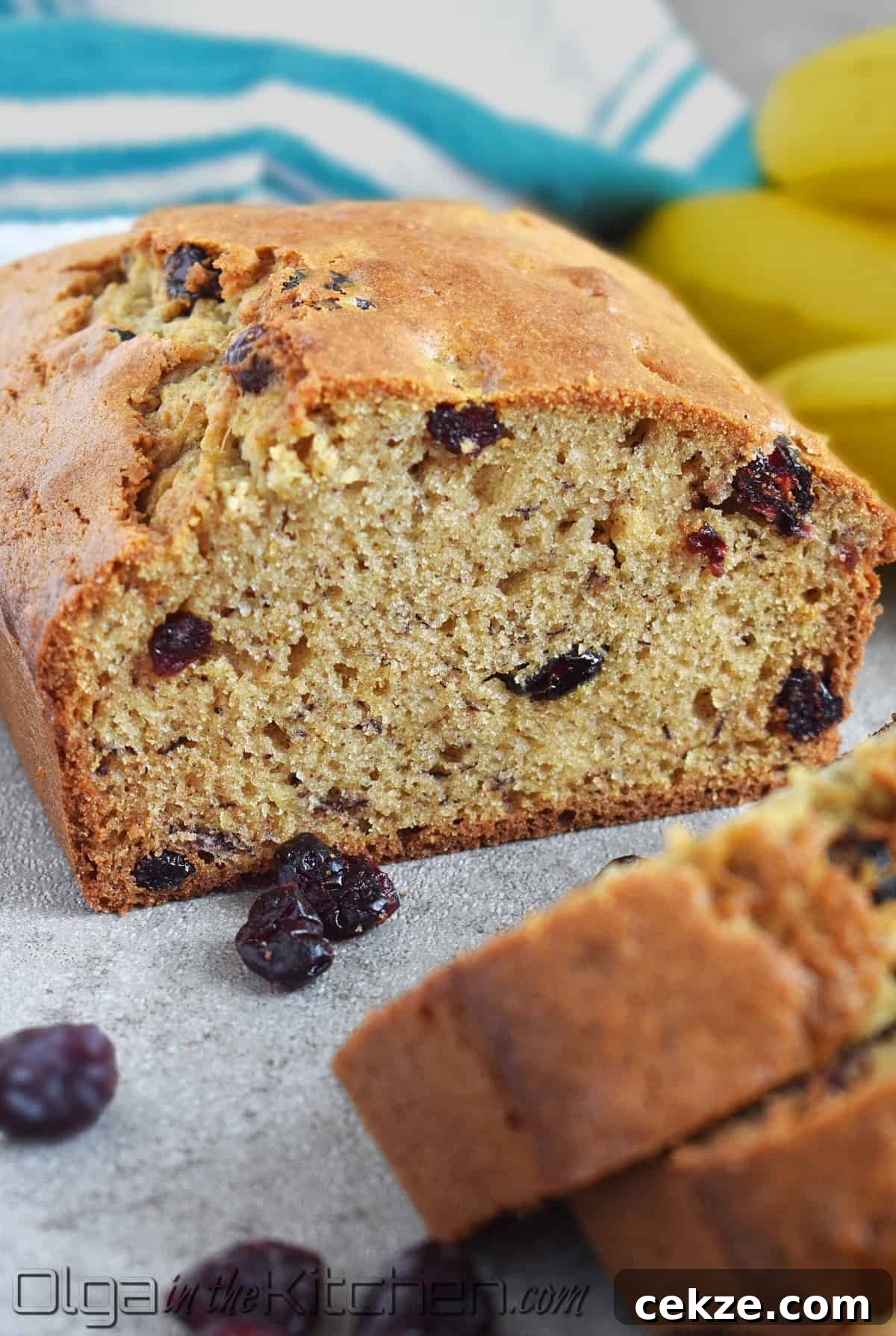 Cranberry Banana Bread is perfectly moist, slightly sweet and loaded with sweet tangy cranberries. This wonderfully moist and soft banana bread is even better with overripe bananas!