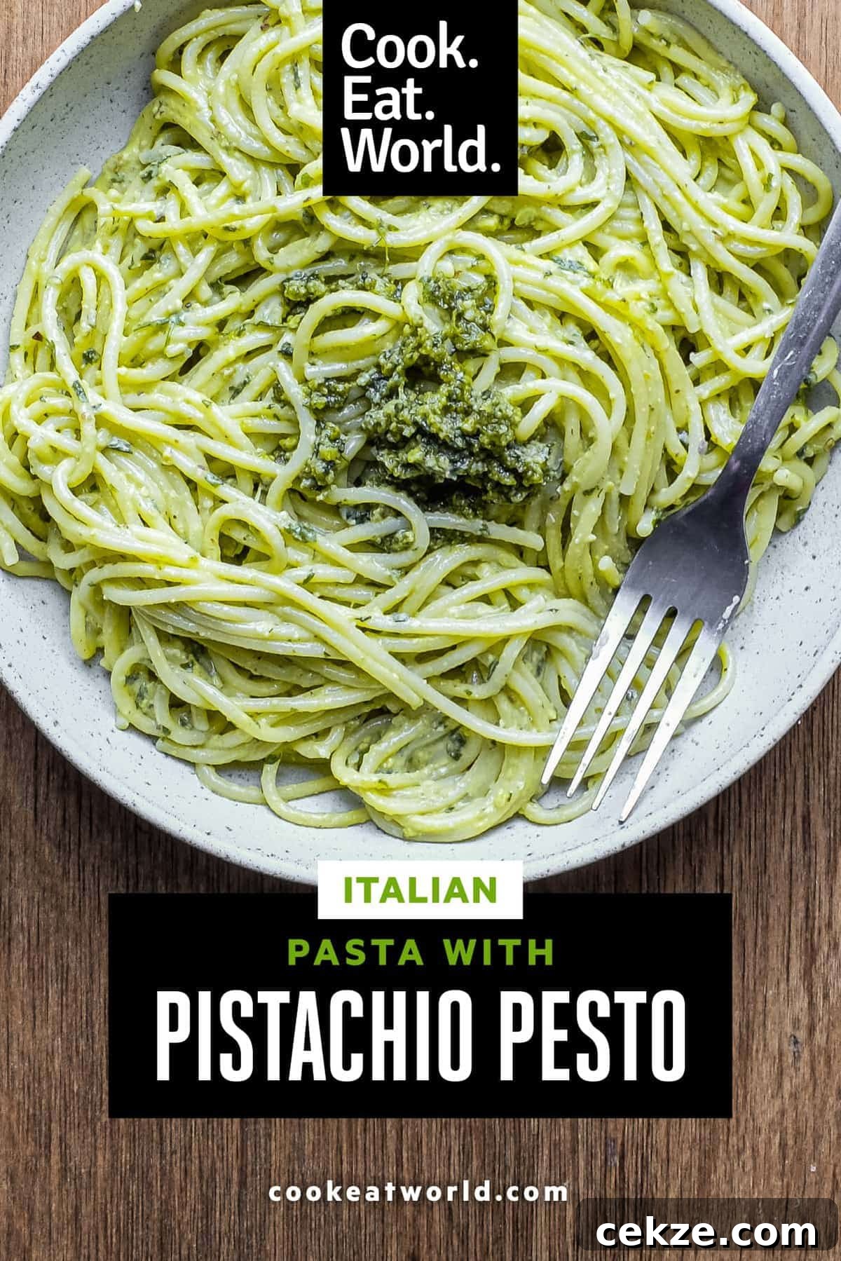Pasta with Pistachio Pesto | cookeatworld.com A fork wraps around spaghetti with Pistachio Pesto in a large bowl