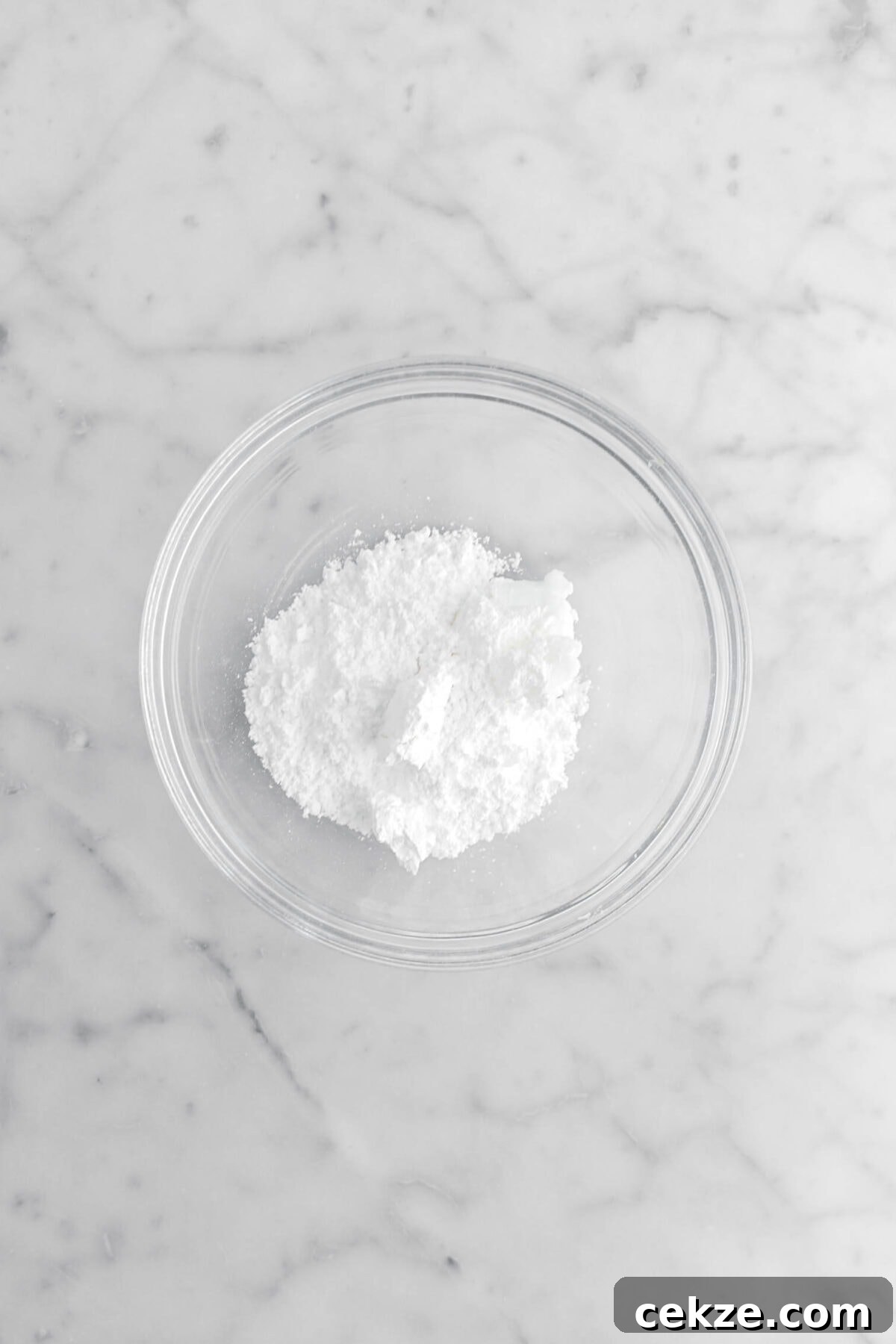 powdered sugar and shortening in glass bowl.