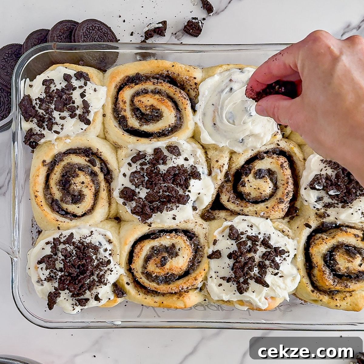 Adding the frosting and cookies.